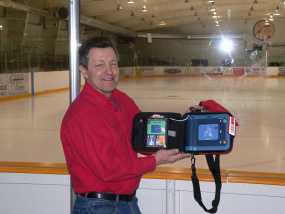 Dave Nuttall holding a PAD at the Port Arthur Arena