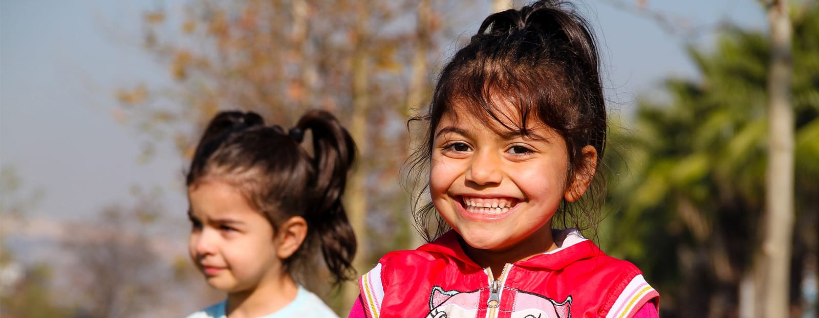 two small children smiling