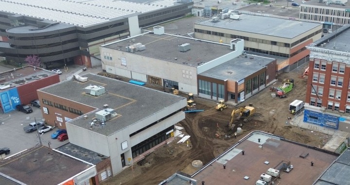 An aerial photo shows the Victoriaville Civic Centre, with the Victoriaville Parkade and nearby construction for the reopening of Victoria Avenue visible in the background.