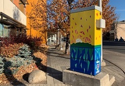Photo of "Inspired at Home" artwork on traffic signal box