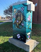 Photo of Mawka (Bear) and Floral artwork on traffic signal box
