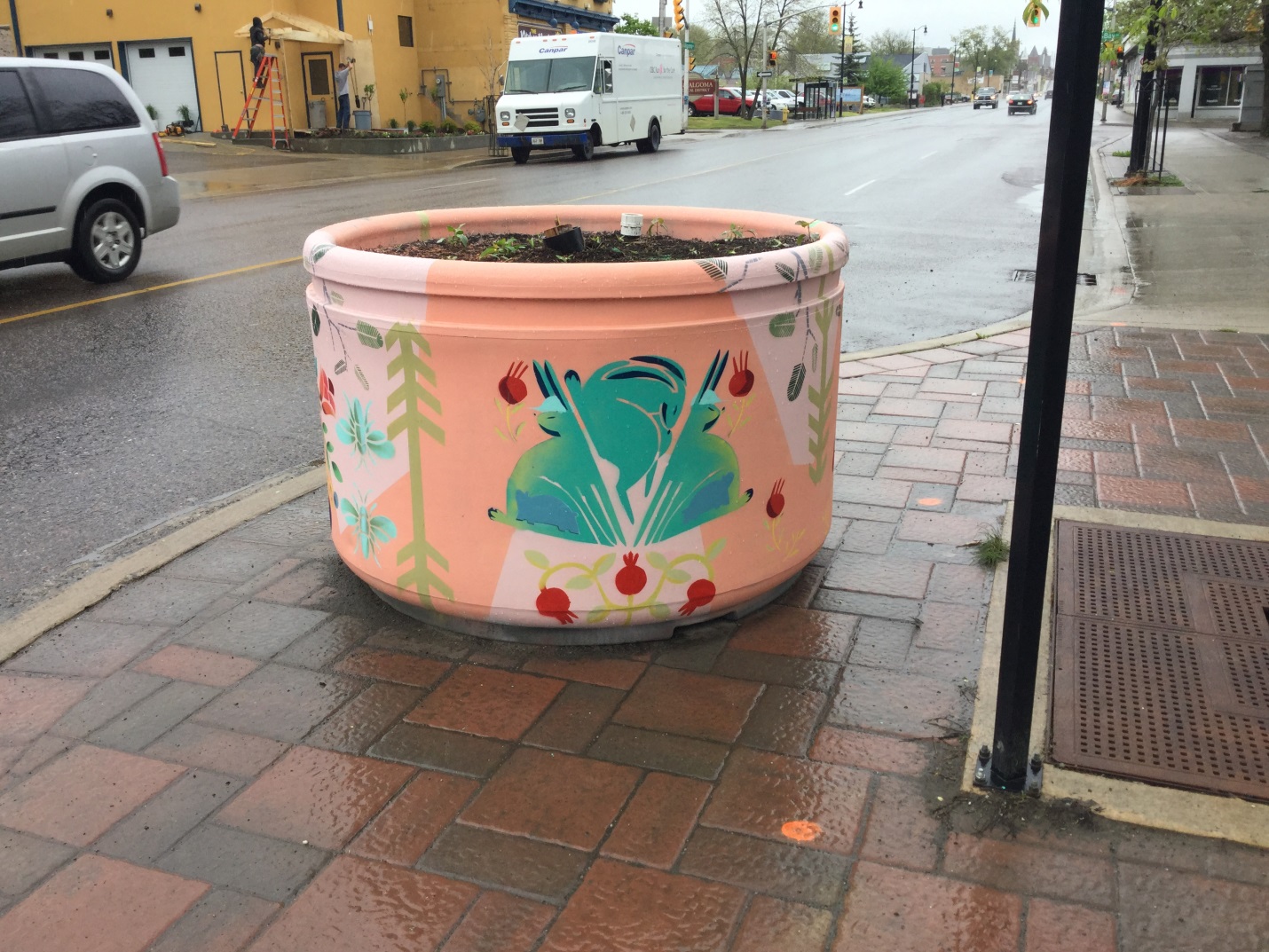 Algoma Street Planters painted in green and peach