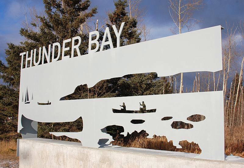 gateway with nature image carved out and words "Thunder Bay"