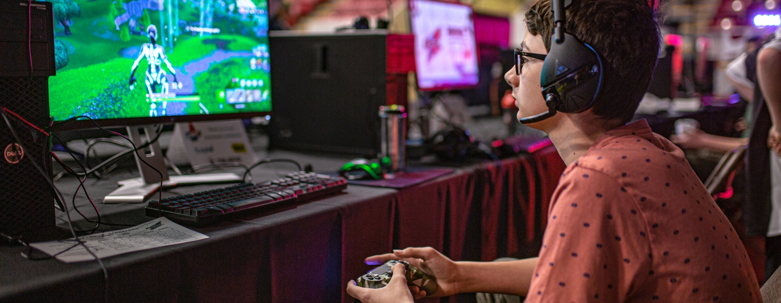boy playing video game at Quest event