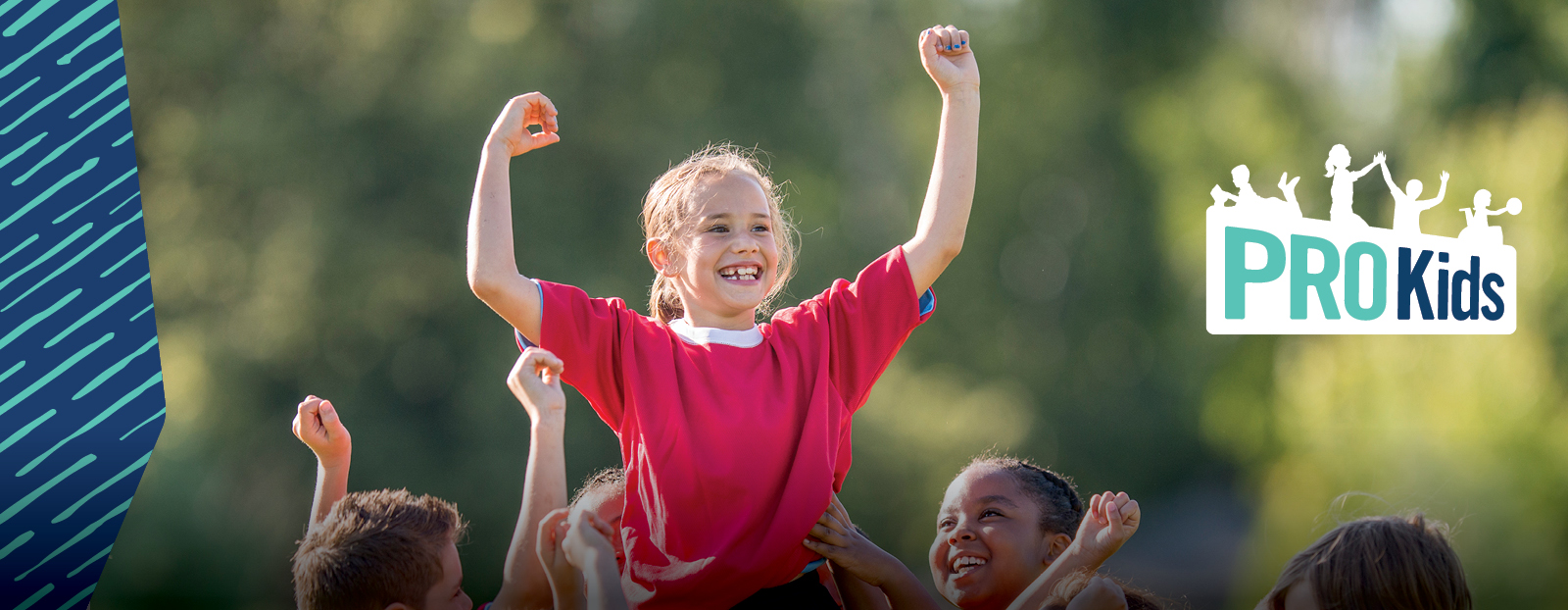 kids holding up teammate at soccer game