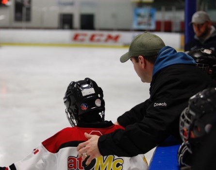 hockey coach and players