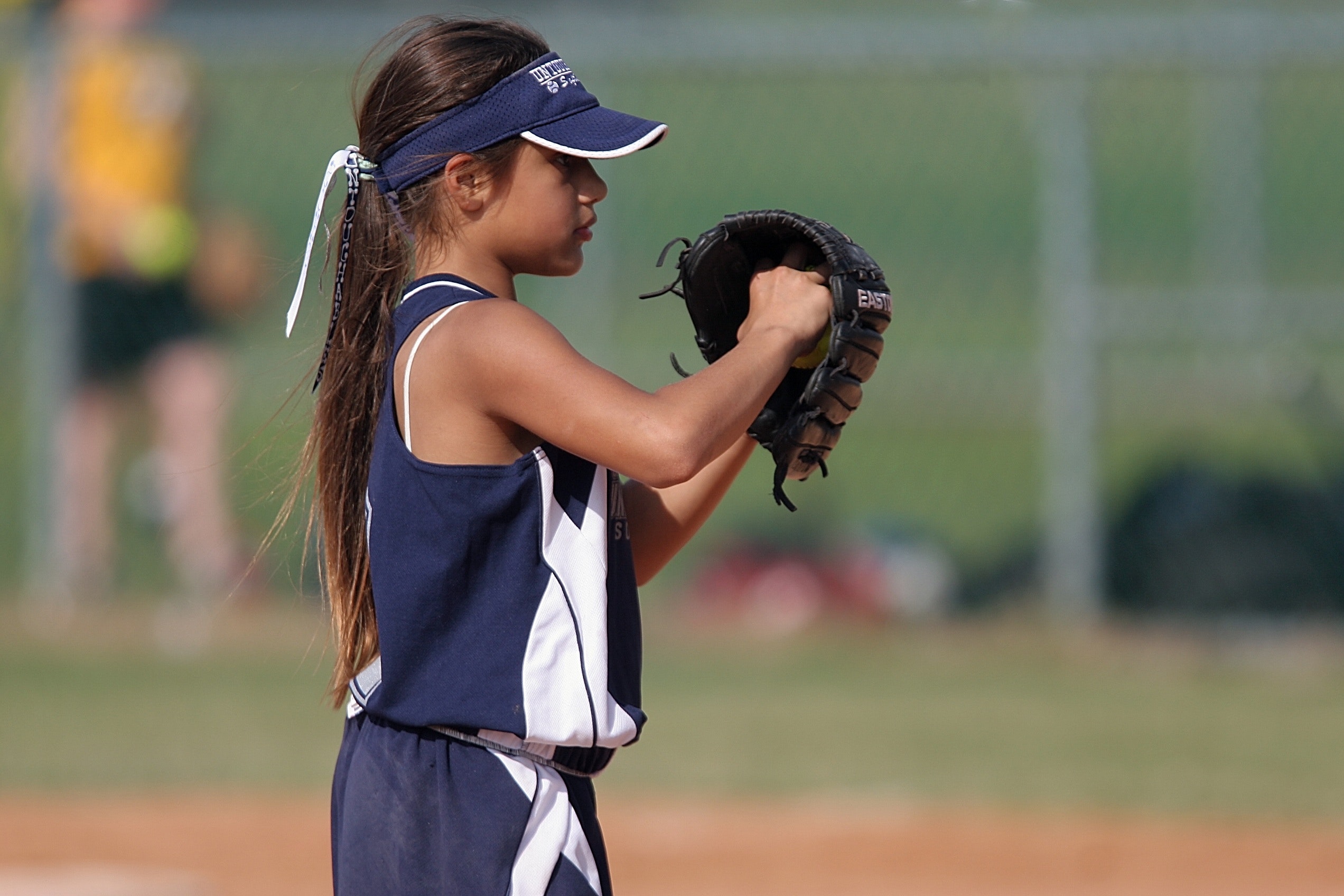 Girl playing baseball