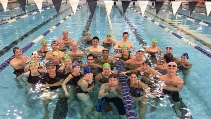 A group of swimmers in the lanes of the Canada Games Complex