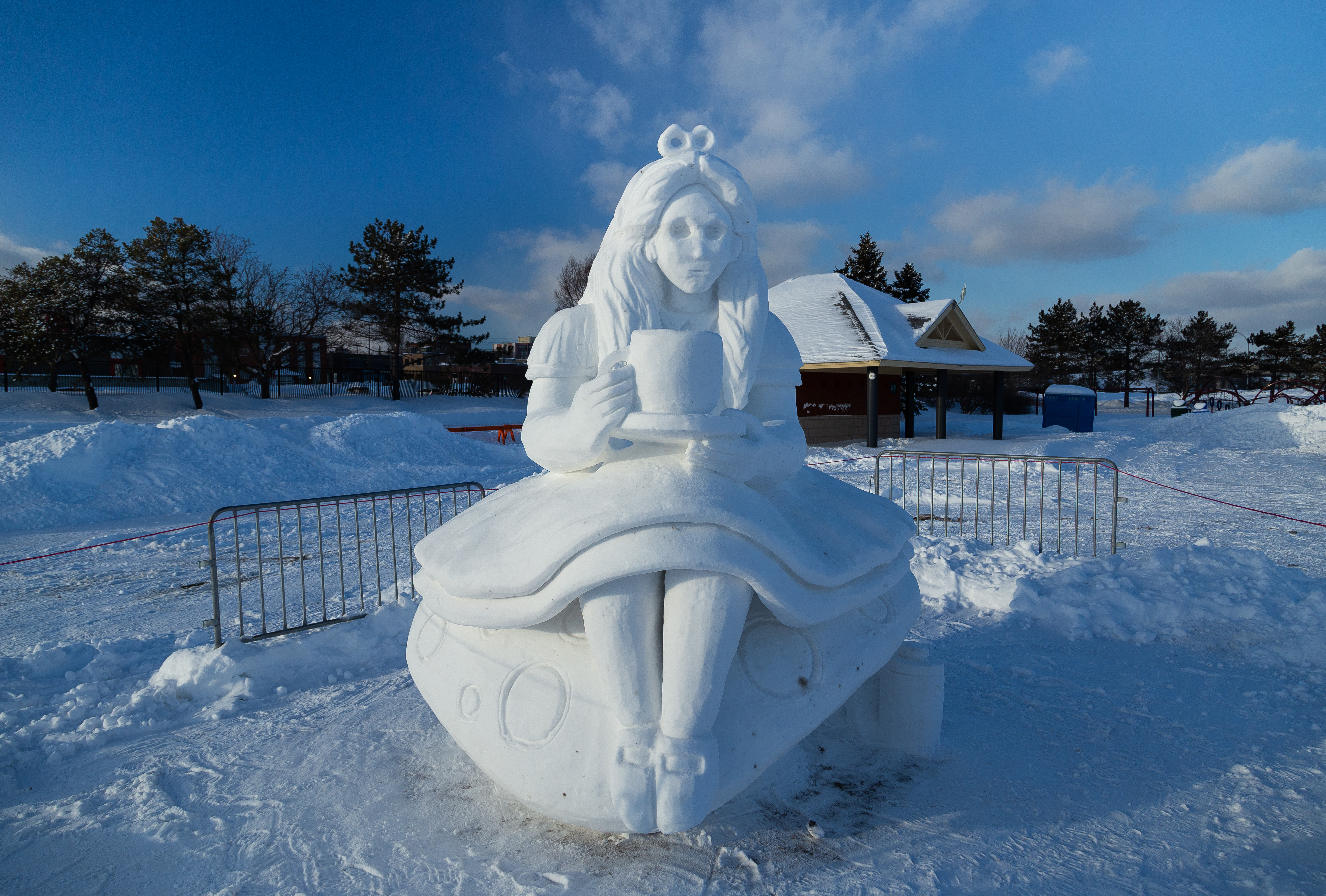 A snow sculpture of alice in wonderland