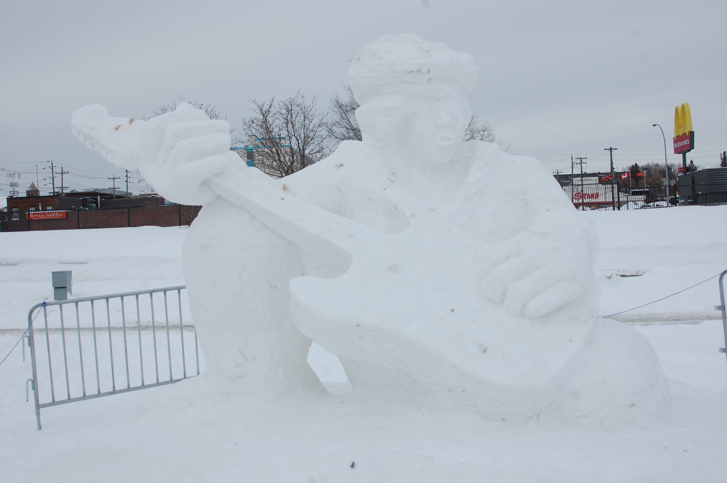 A snow sculpture of Jimi hendricks playing the guitar