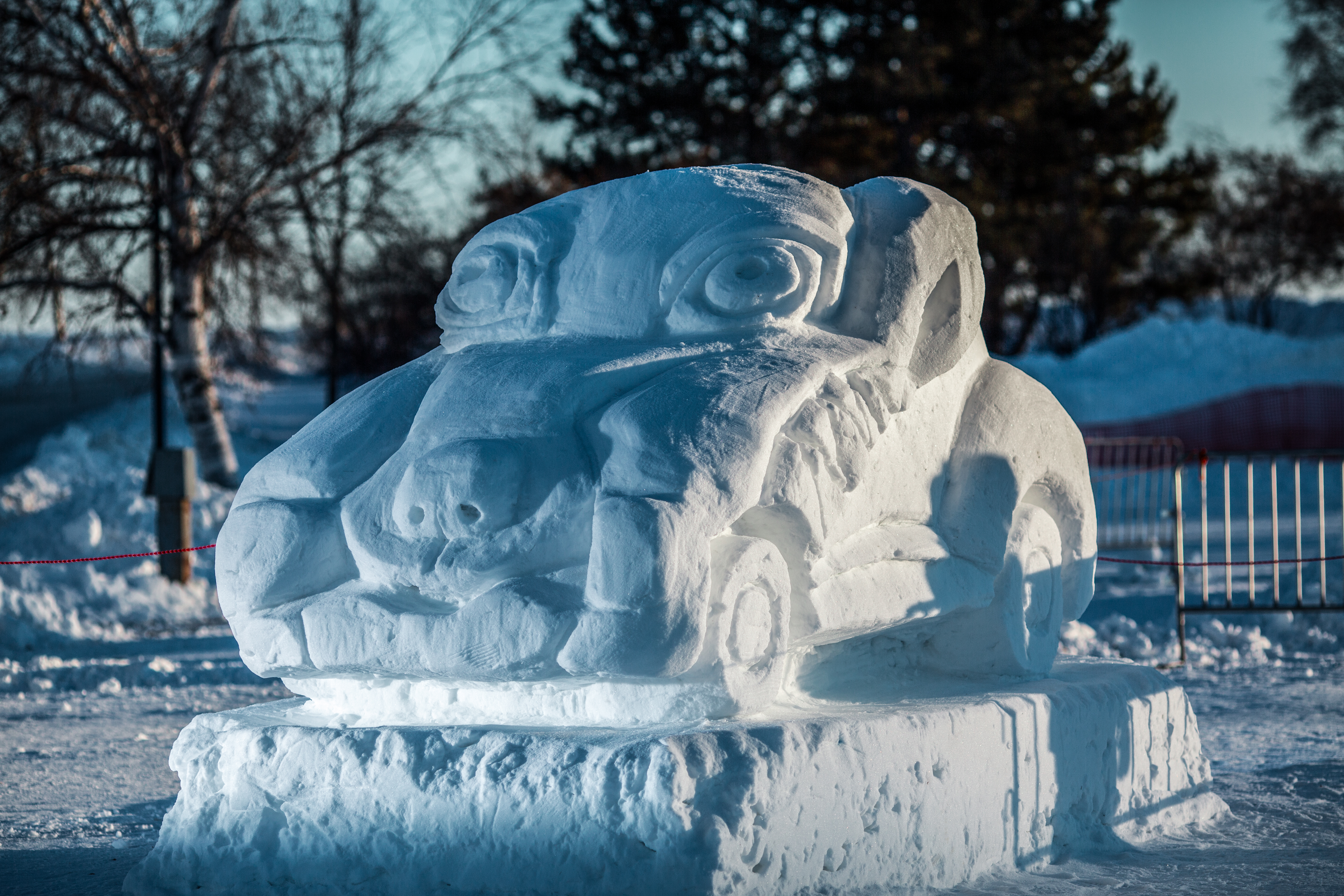 A snow sculpture of a cartoon style car