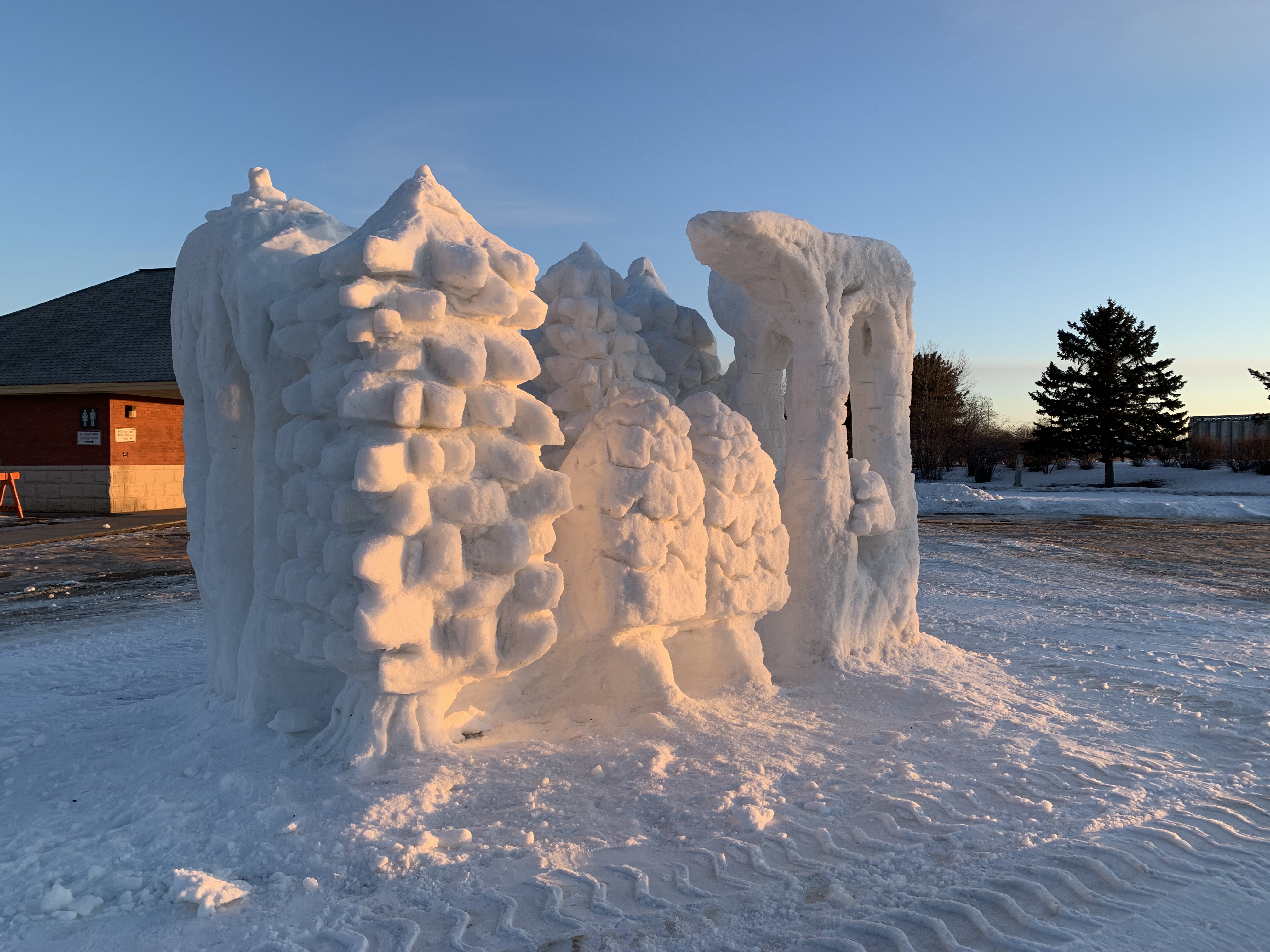 A snow sculpture of a boreal forest