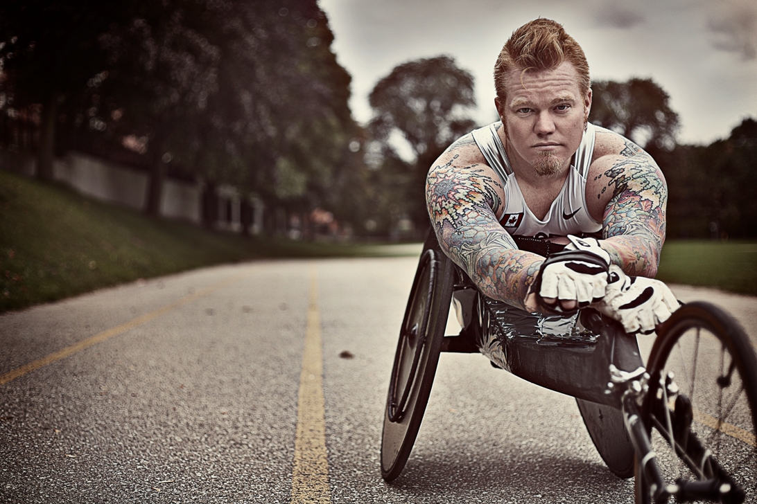 Jeff Adams posing for a picture in his racing wheelchair