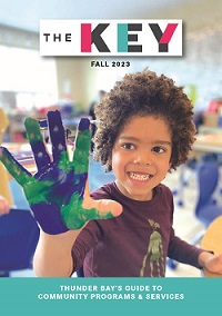 Image of a boy holding up his hand covered in paint on the Key cover