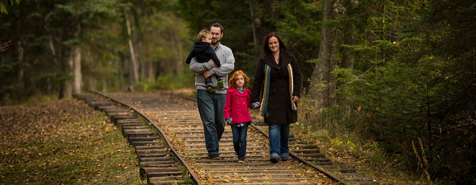 family walking on a trail