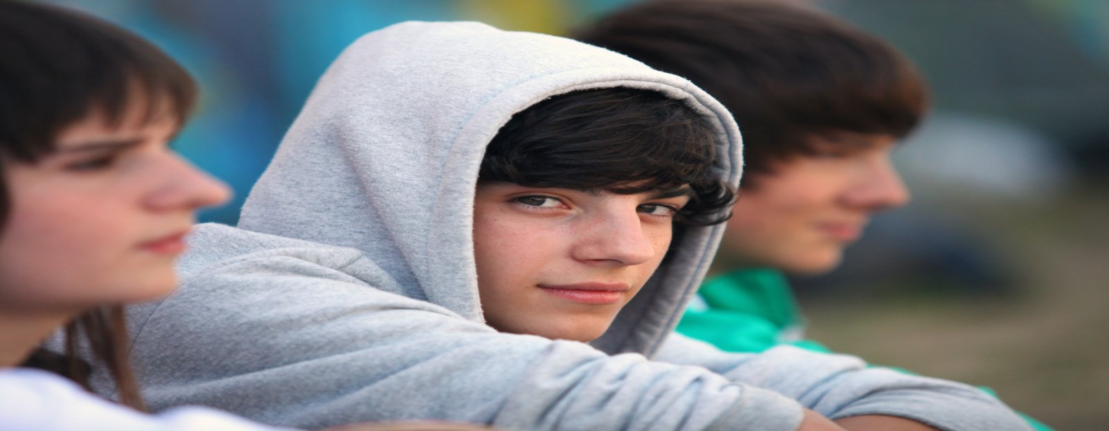 Youth wearing hooded sweatshirt