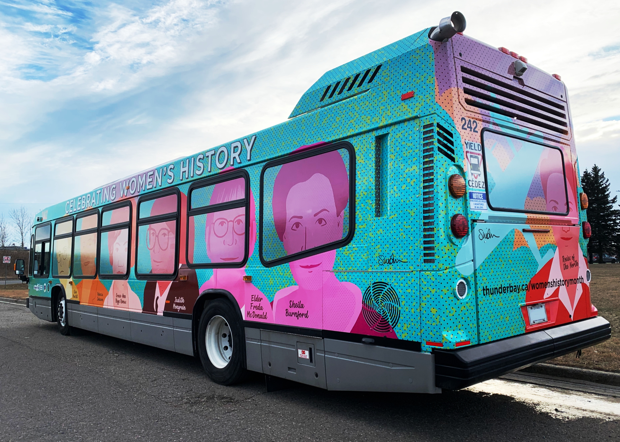 Womens History art bus, showing the left side of the bus with portraits of women in vibrant colours