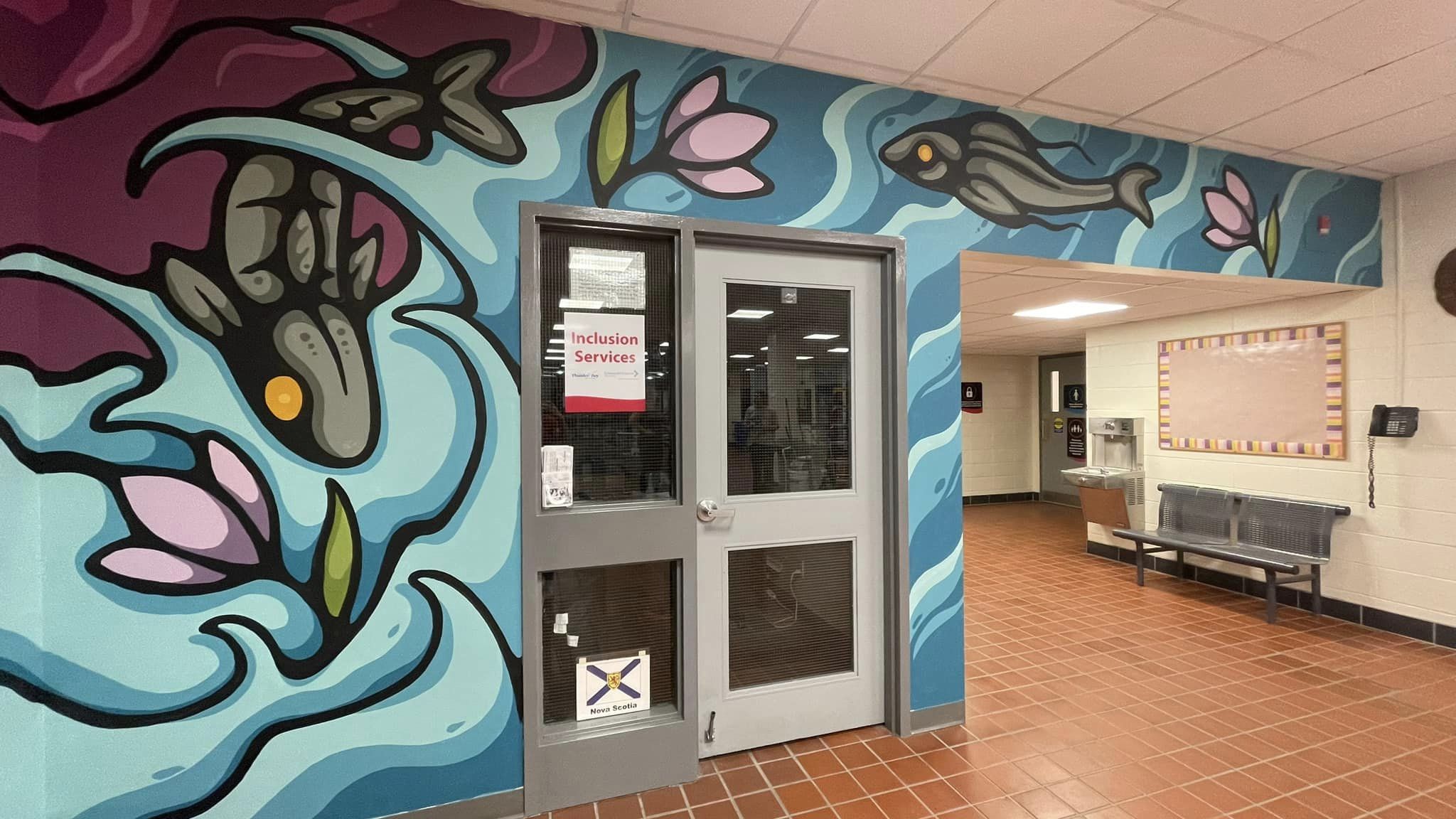 Photo of Ryan Poomans mural showing a water scene with fish and plants