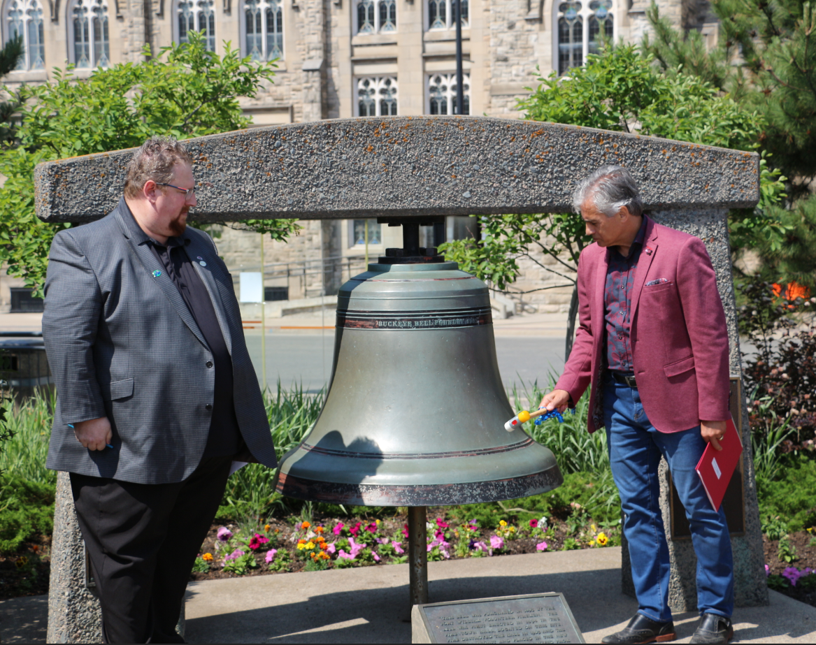 Sister Cities Advisory Committee Chair Matthew Villella and Mayor Bill Mauro ring the Peace Bell