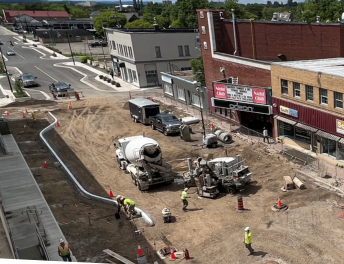 Image of North Core Street Scape Construction - a truck and workers working on a road