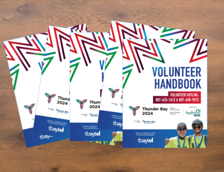 Volunteer Handbooks on a Wood Table