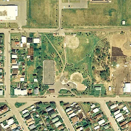 From 1987, image shows considerable development, a baseball diamond, hockey rink, walking paths and treed areas