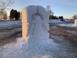 A snow sculpture of a beaver lodge.