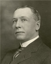 Mayor H. Murphy sitting for a black and white portrait wearing a suit