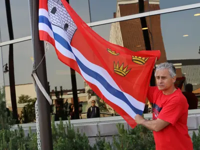 MayorBillMauroRaisingCityofKingstonFlag.PNG