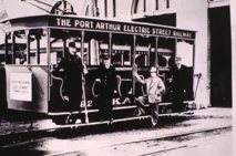 an electric railway car carrying multiple people