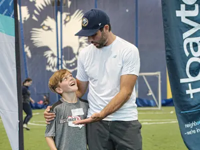 CarterHuttonoftheBuffaloSabreswithparticipantin2019.jpg