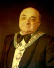 A photo of the Mayor wearing black robes and a large ornamental necklace