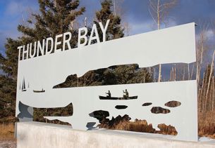 gateway with nature image carved out and words "Thunder Bay"