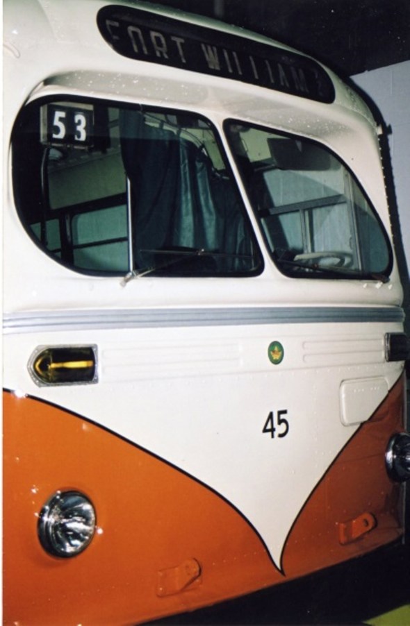 an orange and white Fort William Trolley waiting to be used