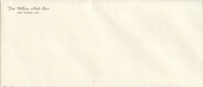A white envelope with writing on the top left hand corner