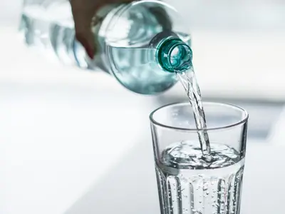 pouring-water-from-pet-bottle-into-a-glass-picjumbo-com.jpg