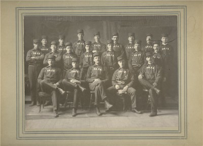 A group black and white photograph of firemen in uniform
