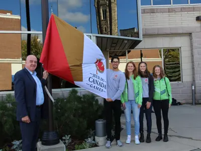 CanadaGamesFlagRaisingwithMayorandMembersoftheNationalDevelopmentCross-CountrySkiTeam.jpg