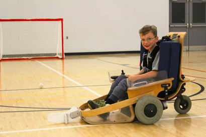 boy using a VOLT chair in a gym