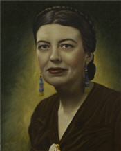 Mayor Eunice Wishart wears a v necked shirt, earrings and has braided hair