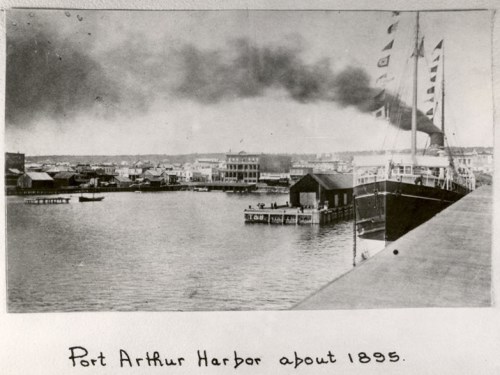 ships sitting in dock along the harbour in Port Arthur