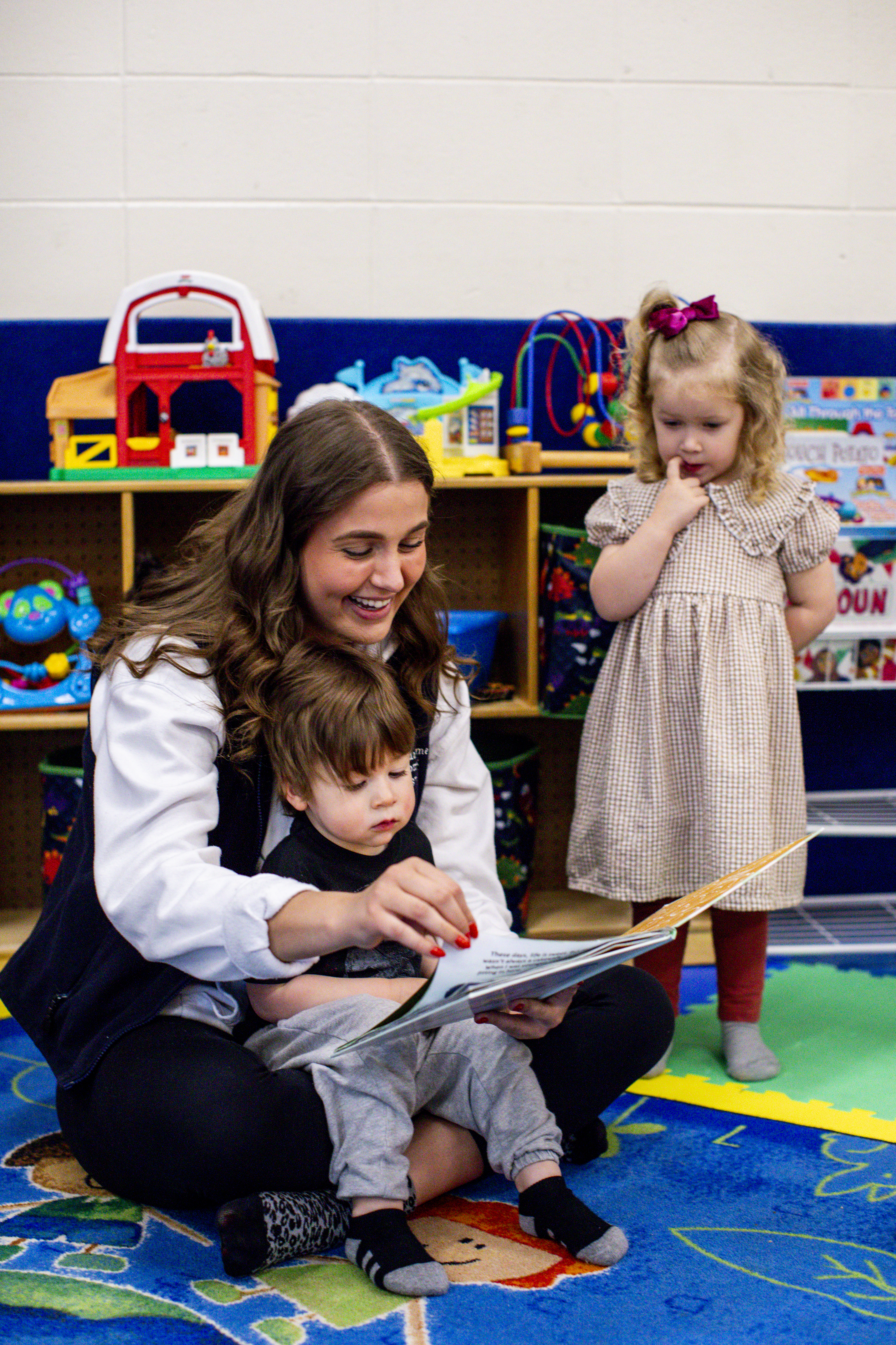 adult reading book to child