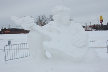A snow sculpture of Jimi hendricks playing the guitar