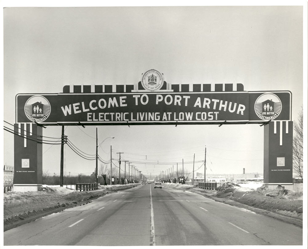 Arch that reads: "Welcome to Port Arthur" Electric Living at Low Cost